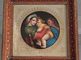 an image of a picture of a woman holding a baby in her lap