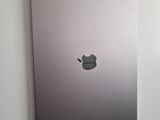 a picture of an apple laptop on a white wall