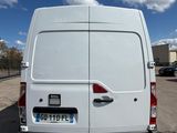 the back of a white van parked in a parking lot