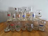 a lot of glasses sitting on a wooden table