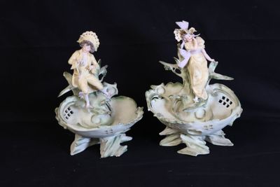 two figurines that are sitting on top of each other