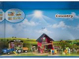 une boîte de Playmobil contenant une scène de ferme