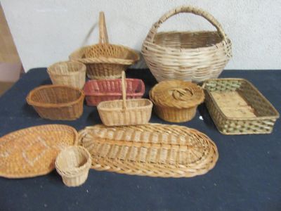 many baskets and baskets on a table with a blue table cloth