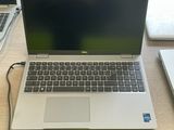 two laptops that are sitting on a table