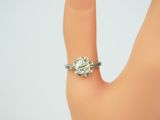 an image of a woman ' s hand with a diamond ring on it