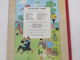 an old children ' s book with a picture of a man and a woman sitting on a bench