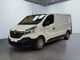 the white van is parked in the large room of the building