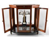 a clock that is sitting inside of a glass case