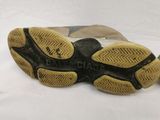 a close up of a pair of shoes on a white surface