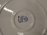 a white plate with a blue and white design on it