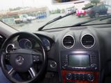 dashboard of a car with a view of a parking lot from inside