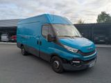 a picture of a blue van parked in a parking lot