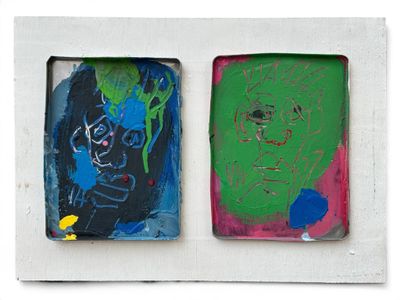 two paintings of a man and a woman on a white wall