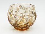 a glass bowl with a design on it on a white surface