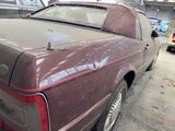 a dirty car that is parked in a garage