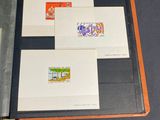 a lot of different stamps on a folder on the table