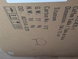 a cardboard box with a label on it on the floor