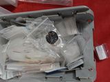 a plastic container with a bunch of items inside of it
