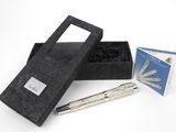 a black box with a silver pen and a box with a silver pen