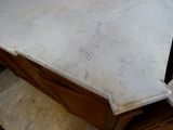 a marble counter top in a kitchen with a sink