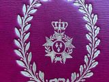 an image of a close up of a purple book with a crown on it