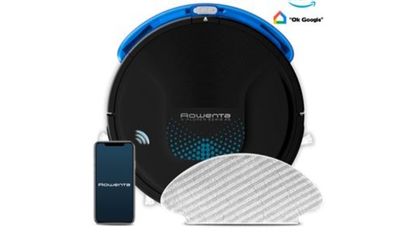 une image d'un aspirateur robot avec un téléphone à côté