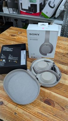 a box of headphones sitting on a wooden table