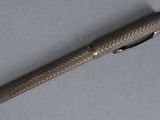 a pen that is laying on a table