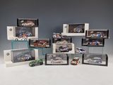 a lot of different model cars on display in a display case