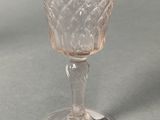 a glass cup that is sitting on a table