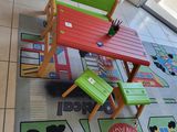 brightly colored children ' s table and chairs in a brightly colored area rug
