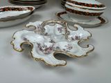 many plates and bowls that are sitting on a table