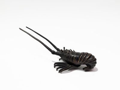 an image of a toy lobster on a white surface