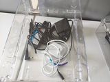 an image of a clear box with wires and cords in it