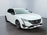 a white car is parked in a white room with a black floor