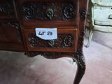 a small desk with a sign on it in a room