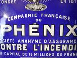 a blue sign that says phenix on the side of a building