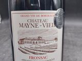 a bottle of wine that is sitting on a table