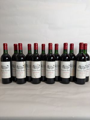 six bottles of wine are lined up on a table