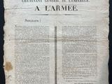 an old newspaper with a piece of paper on top of it