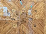 a picture of a clock on a wooden table