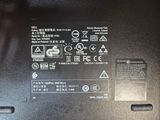a close up of a laptop with a battery on it