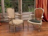 two chairs that are sitting in front of a window