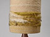 a lamp that is sitting on a wooden table