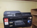 a printer sitting on top of a shelf in a room