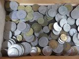 a box full of silver and gold coins sitting on a table
