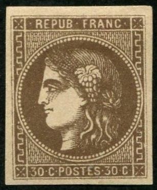 a brown stamp with a woman ' s face on it