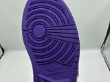 a close up of a pair of purple shoes on a white surface