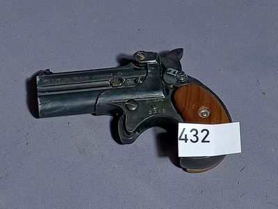 a small gun that has a price tag on it