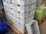 a stack of crates sitting on a pallet in a warehouse